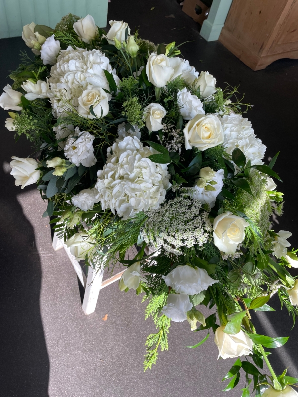 White casket spray