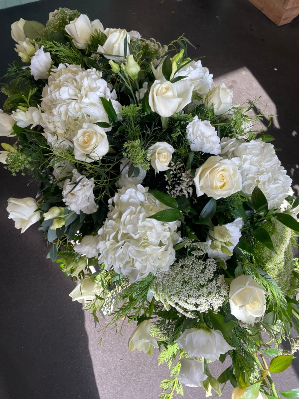 White casket spray